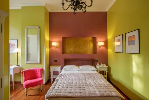 Camera Singola Superior del Fenix Hotel Roma con letto matrimoniale francese e poltroncina